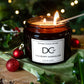 Triple Wick Cranberry Marmalade Candle by Dundee Candle Works surrounded by Christmas decorations
